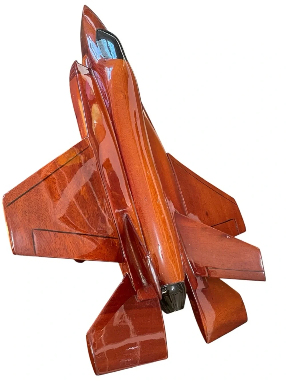 Mahogany wood model of a stealth fighter jet, handcrafted